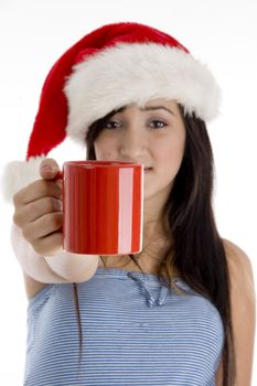 girl with mug and christmas hat on  an isolated white background 