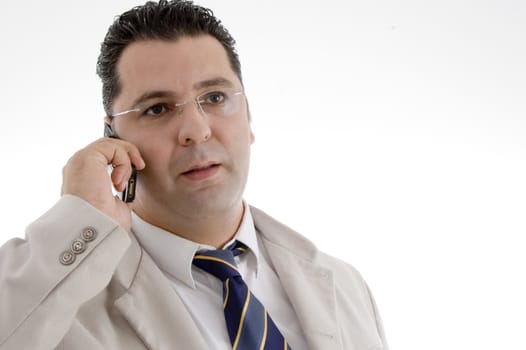 portrait of businessman talking on cell phone on  an isolated white background 