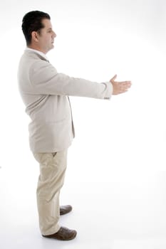 side view of businessman offering hand shake on  an isolated white background 