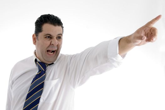 angry businessman pointing side on  an isolated white background 