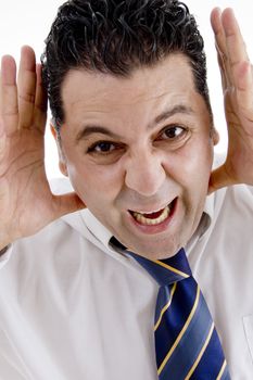 businessman making funny face with hands on  an isolated white background 