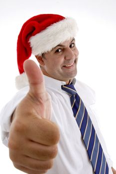 smiling businessman with christmas hat showing approval sign on  an isolated white background 