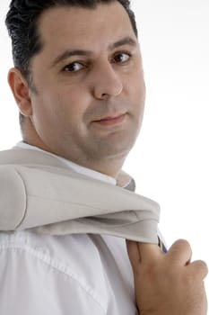 mature businessman posing with coat on  an isolated white background 
