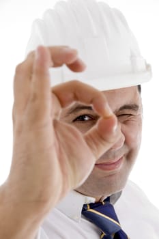 smiling architect showing ok gesture on  an isolated white background 
