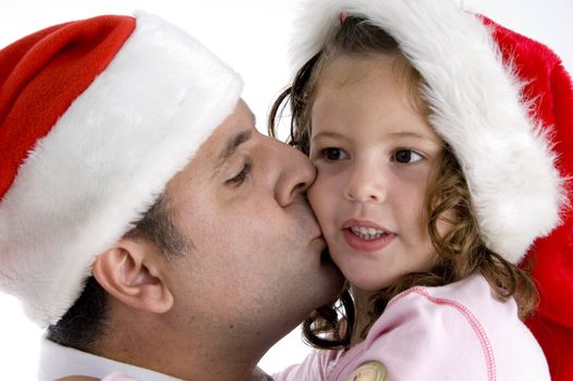 father kissing his cute daughter