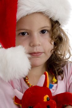 close up of cute little girl wearing christmas hat
