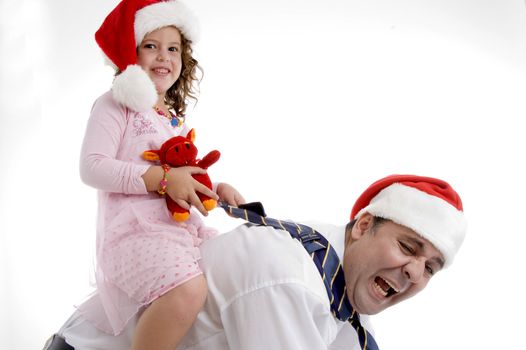 smiling little girl sitting on her father's back