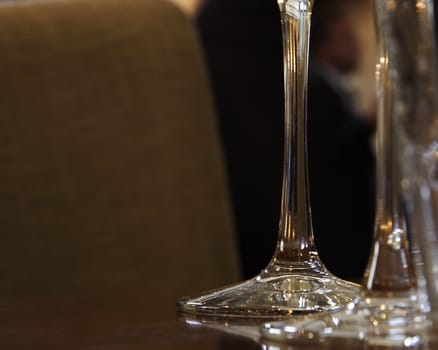 tall glass stems on a wooden table