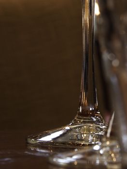 tall glass stems on a wooden table