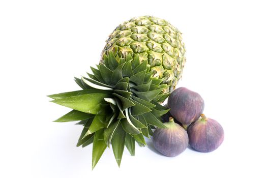 Fresh ananas and figs isolated on white background.