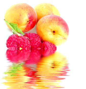 close-up of raspberry with leaves and apricots