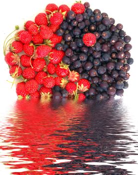 yin yang symbol made of fresh strawberries and bog bilberries