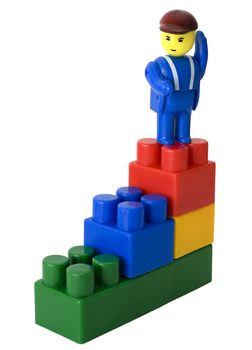 The toy little man to a ladder from cubes