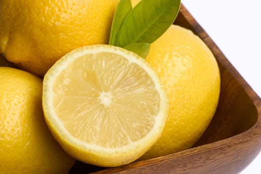 A bowl of bright yellow lemons.