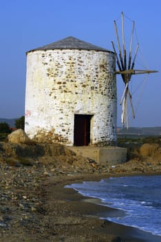 The old windmill at the beach of Kalives in Halkidiki (Greece).