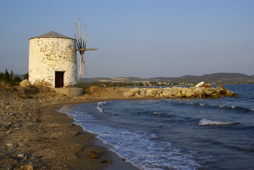 The old windmill at the beach of Kalives in Halkidiki (Greece).