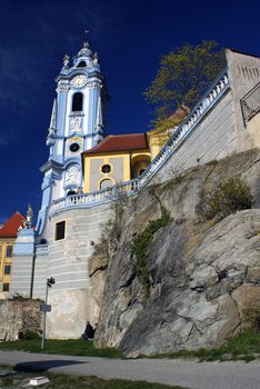 The colorful parrish church of Durnstein (Austria) on a sunny spring day.