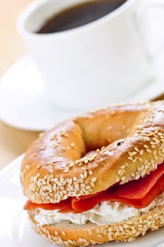 Light meal of smoked salmon bagel and coffee