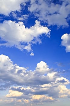 Background of blue sky with white cumulus clouds