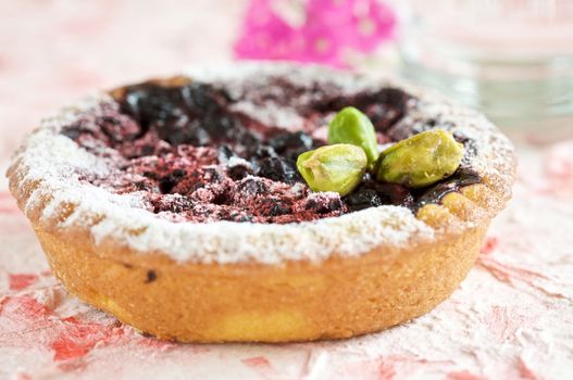 Delicious small cake filled with prunes and pistachio nuts