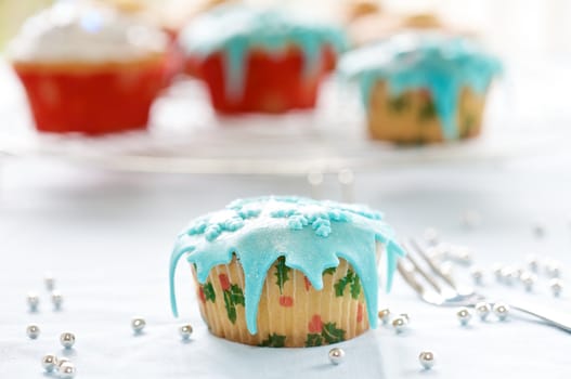 Small cupcakes decorated with marzipan for christmas