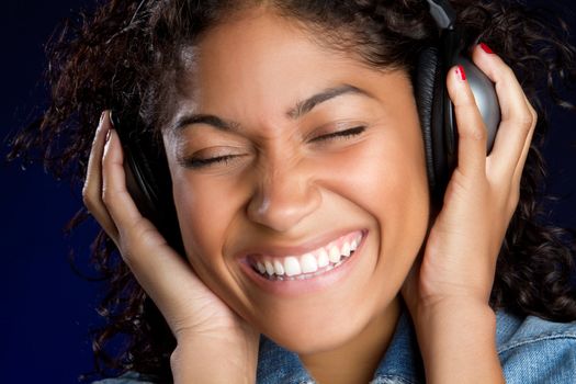 Smiling girl listening to headphones music