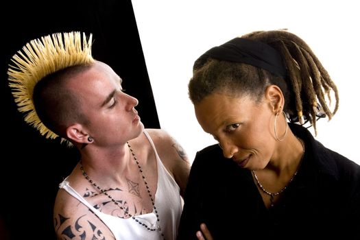 Portrait of white man with mohawk and black woman with dreadlocks