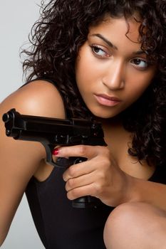 Sexy black woman holding gun