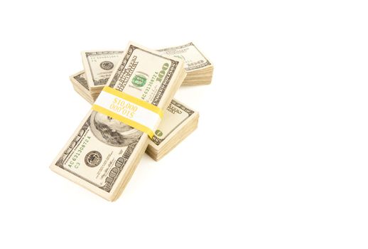 Stacks of Ten Thousand Dollar Piles of One Hundred Dollar Bills Isolated on a White Background.