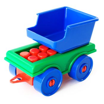 Nursery multi-coloured toy trailer on a white background