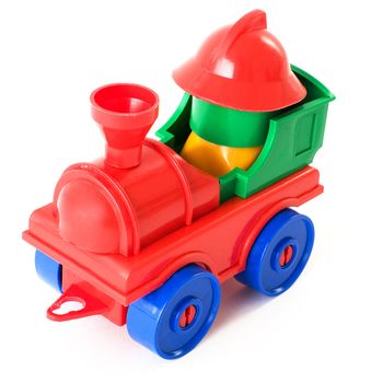 Nursery multi-coloured toy steam-engine on a white background