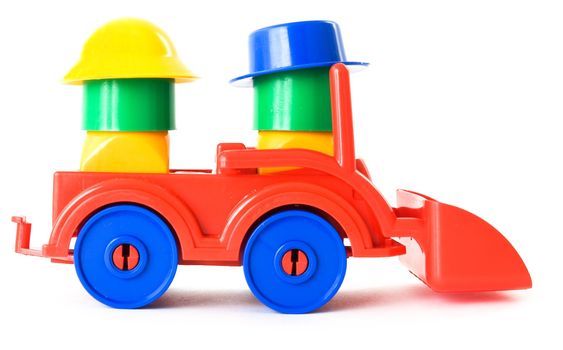 Nursery multi-coloured toy machine on a white background