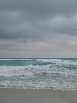 turquoise tropical ocean and dark blue sky