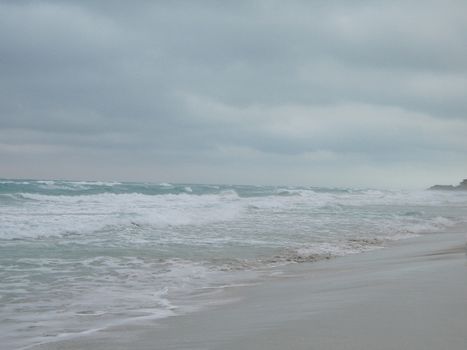 turquoise tropical ocean and dark sky