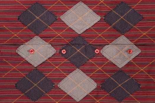 front view of red fabric, striped and grid texture