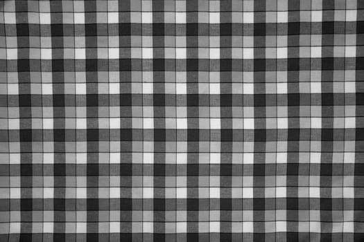 detail of fabric print with black and white grid