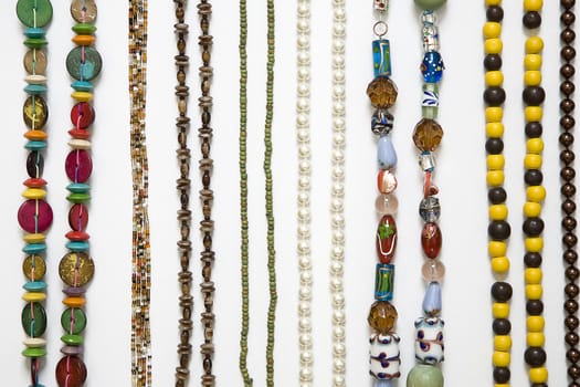 coloured chain of beads, arranged in a vertical strips