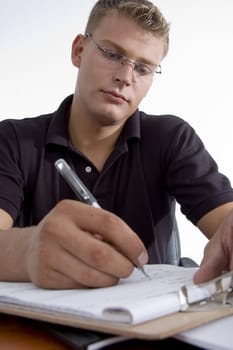 american man writing on notepad on an isolated background