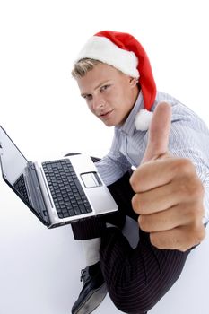 man with christmashat and laptop with white background