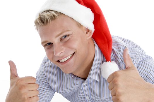 happy man with christmas hat wishing good luck on an isolated background