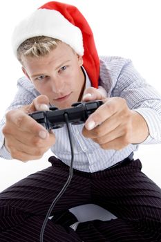caucasian man with remote and christmas hat with white background