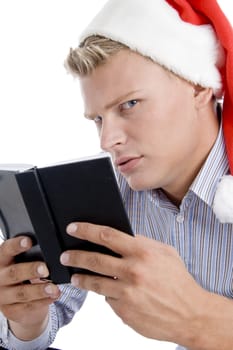 man holding book and looking askance with white background