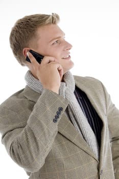 smiling young caucasian interacting on mobile on an isolated white background