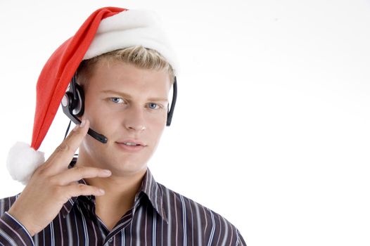 american man wearing headphone and santa hat isolated on white background