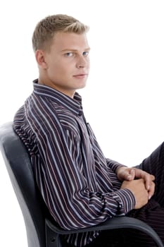 handsome businessman relaxing on chair on an isolated white background