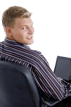 smart guy with laptop looking at camera  against white background