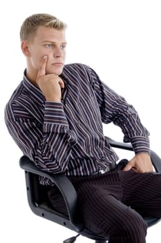 young caucasian sitting on chair thinking isolated with white background