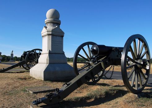 Old cannons beside a monument in Gettysburg