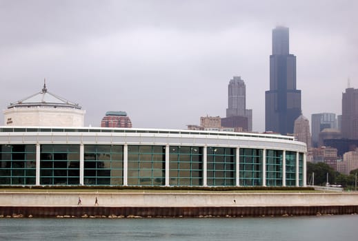 A picture of the Chicago skyline with the aquarium in the foreground