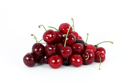Heap of sweet cherries isolated on white